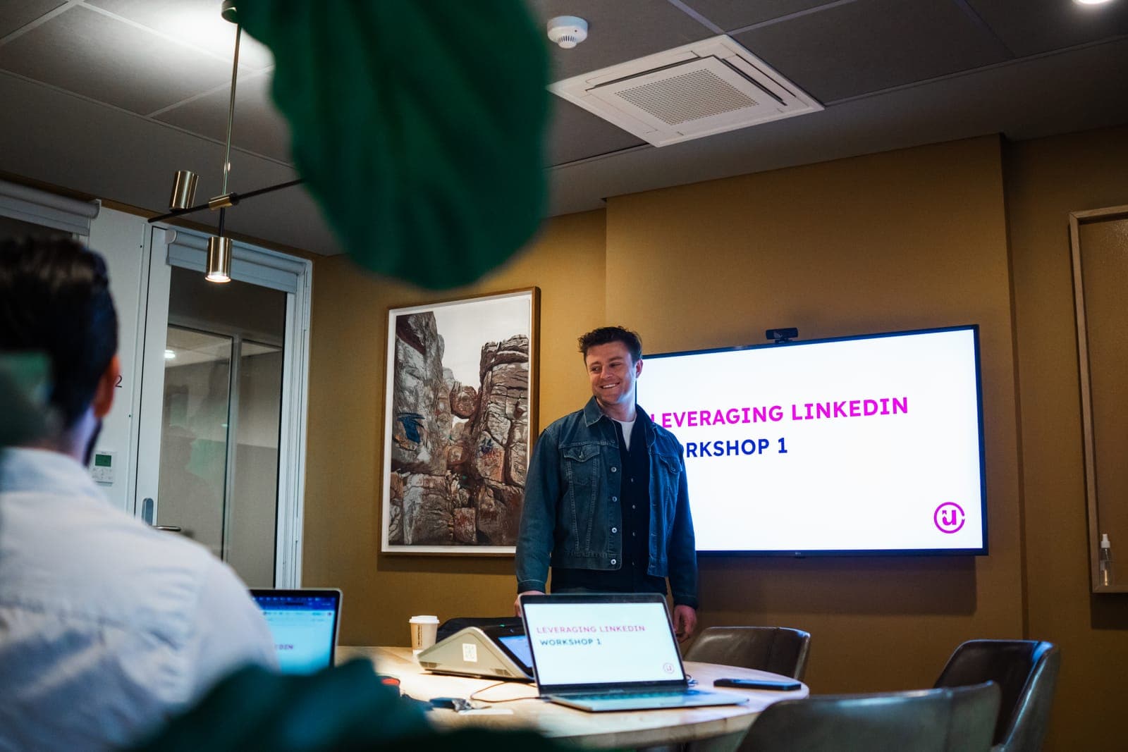 A Unyfy 'Leveraging LinkedIn' workshop in session, presenter in front of the screen